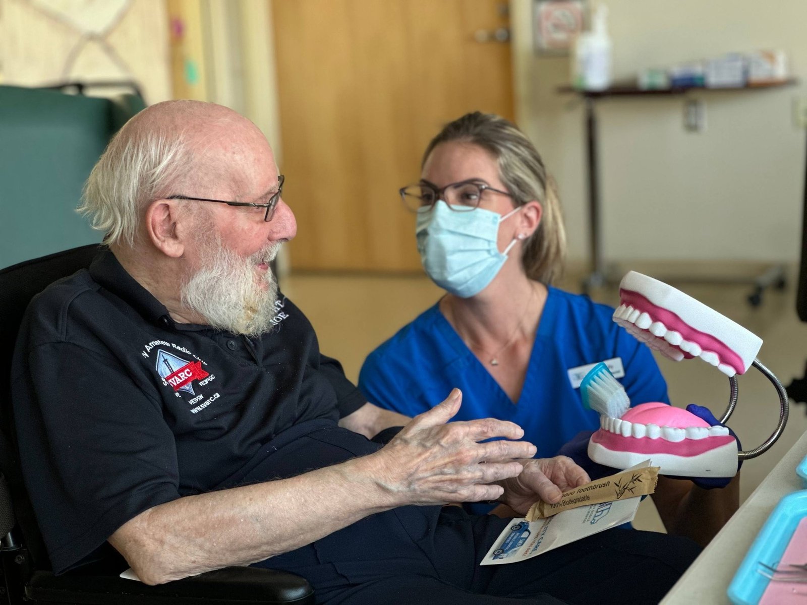 Dental professional conducting a mobile oral health assessment for a senior patient