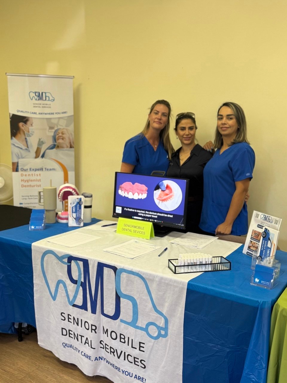 The Senior Mobile Dental Services team at an information booth