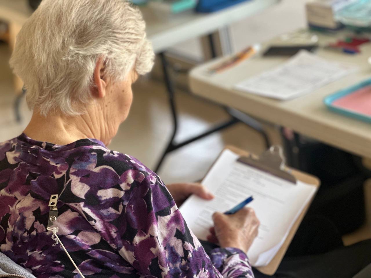 Resident signing a consent form before treatment